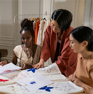 Women Looking at Projects in Atelier